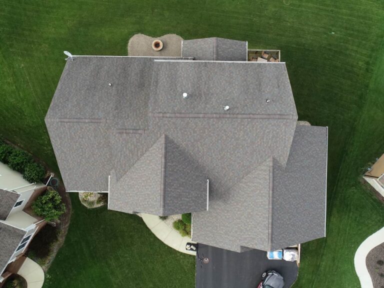 Aerial view of a gray asphalt shingle roof on a large home
