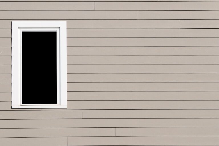 Close-up of tan horizontal vinyl siding