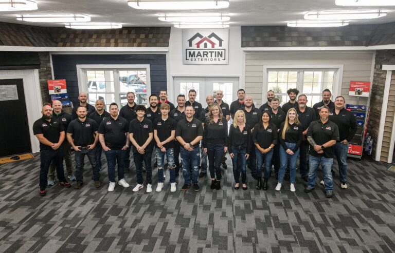 Martin Exteriors team group photo inside the company showroom