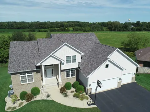 Aerial view of a finished gray shingle roof by Martin Exteriors | Martin Exteriors