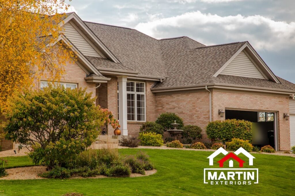 Brown shingle roof by Martin Exteriors on a brick home with several gables