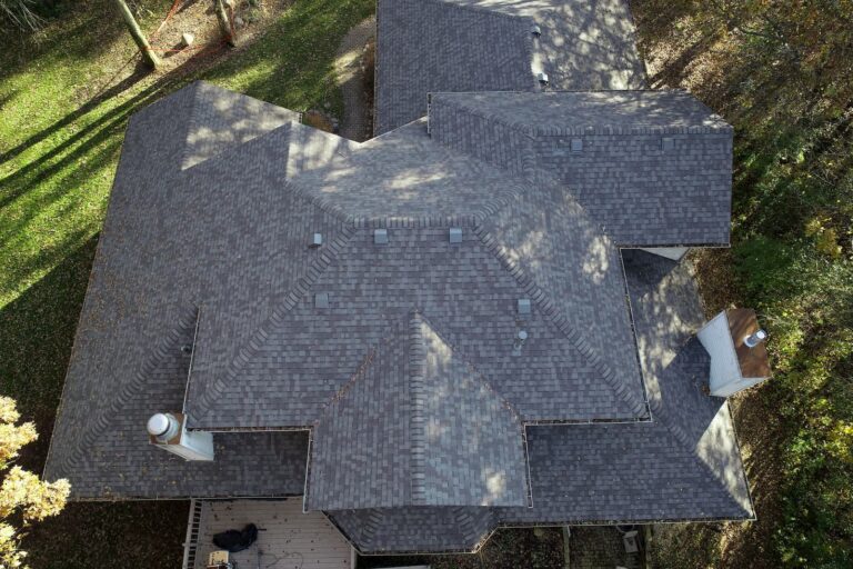 Rockford-area architectural shingle roof by Martin Exteriors, overhead drone view of a multi-gable roof