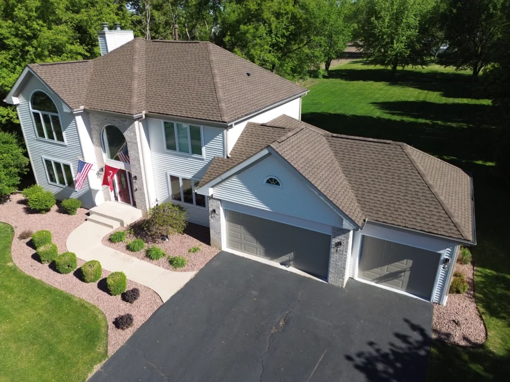 Aerial view of a Rockford, IL home with a new GAF Timberline UHDZ roof in the color Barkwood