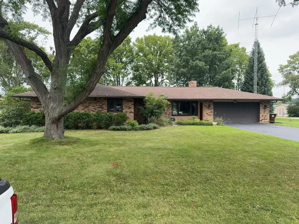 Old asphalt shingle roof on a brick ranch home in Rockton, IL before replacement