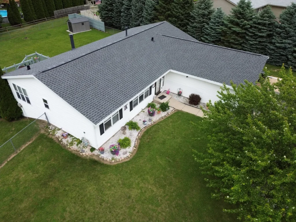Aerial view of a Roscoe, IL home with a new GAF Timberline UHDZ roof in the color Pewter Gray