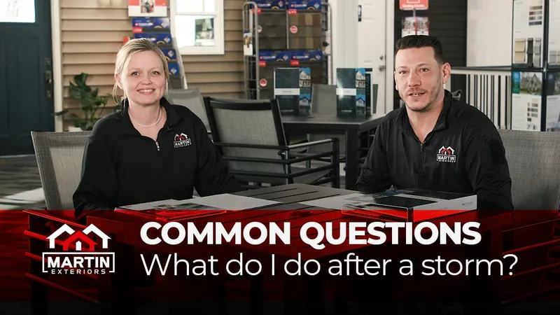 Two Martin Exteriors team members at a table in the showroom answering common questions